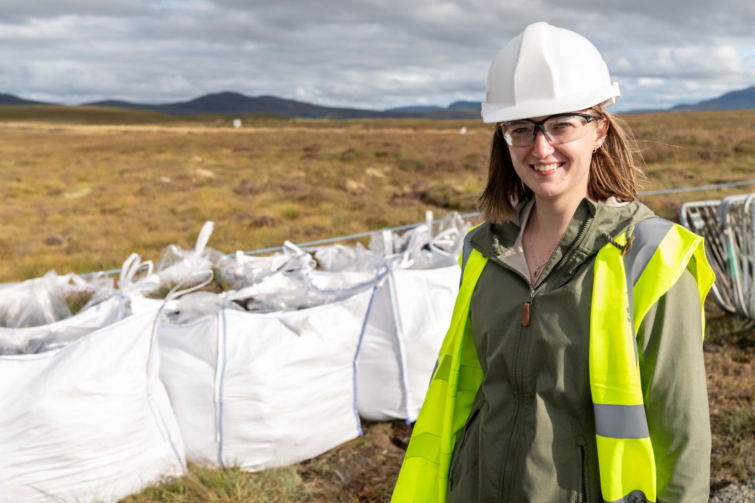 Ph D student Georgina Page at Sutherland Spaceport site with peat extracted during construction 2 Courtesy of Orbex 1